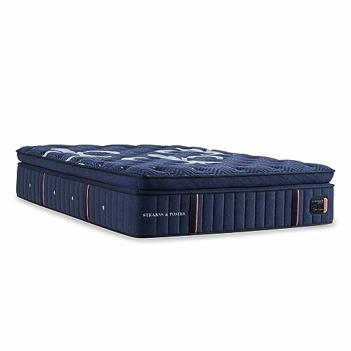 Luxury plush mattress with a deep blue quilted design and side handles.