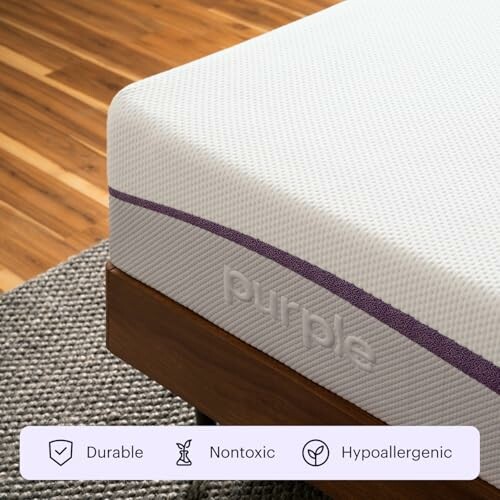 Close-up of Purple mattress corner on wooden bed frame, highlighting durability, nontoxic, and hypoallergenic features