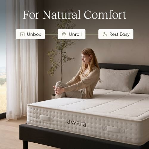Woman sitting on an Awara mattress with text 'For Natural Comfort'.